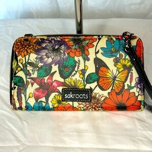 SAK ROOTS colorful floral printed wristlet.